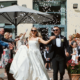 Bride and groom Tara and Gavin walking together outside Fota Island Resort after their wedding ceremony at Honan Chapel UCC in Cork, filmed by an Irish wedding videographer